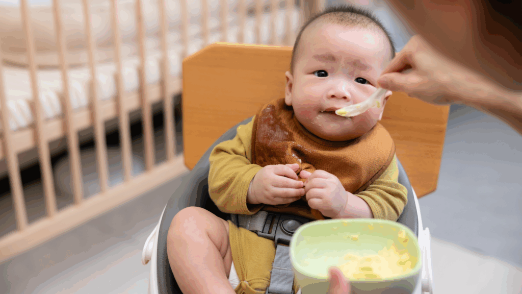 baby learning to eat solids