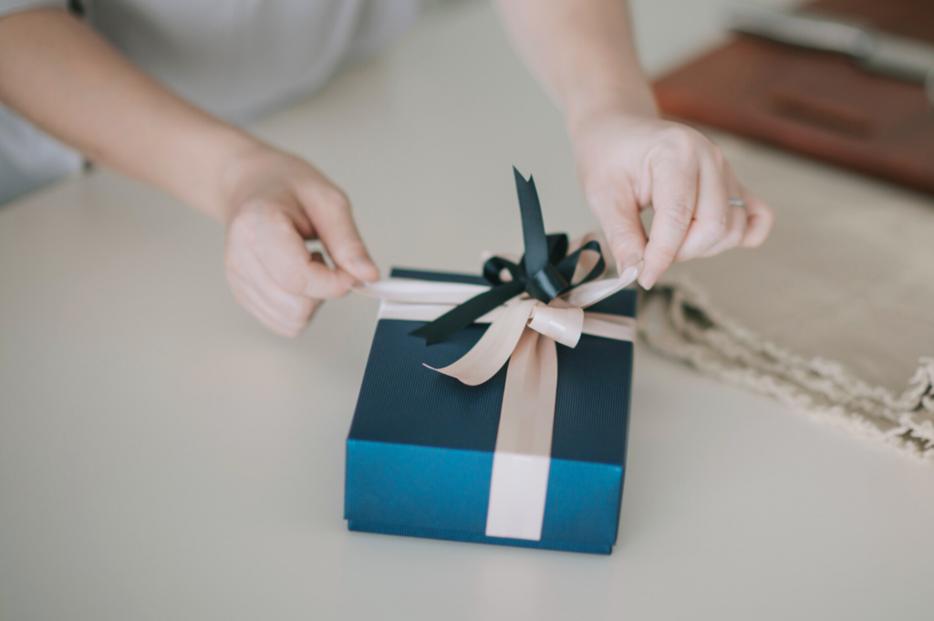 woman wrapping a gift