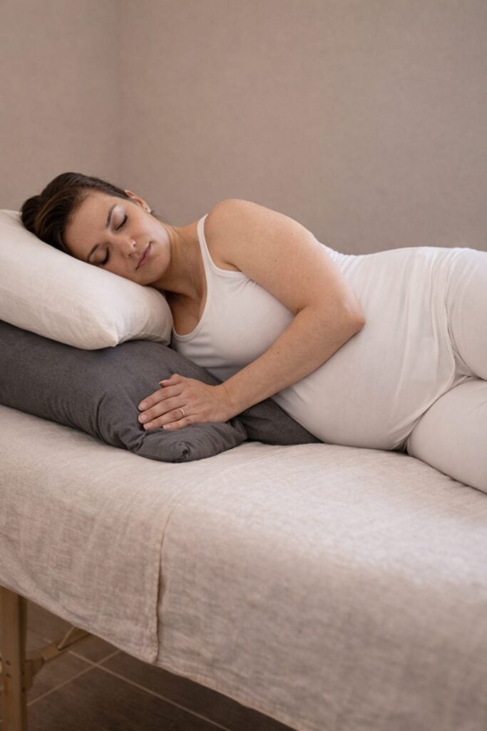 Pillows and Specialized bolsters for safe prenatal massage positioning at kāer Toronto