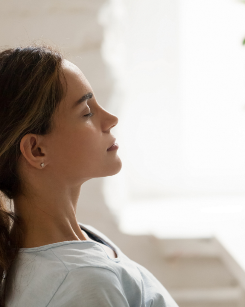 woman enjoying red light therapy at Toronto wellness clinic